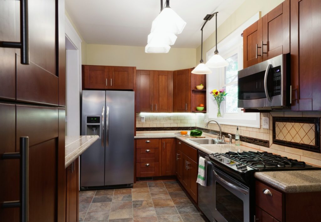 appliances and cabinets in kitchen